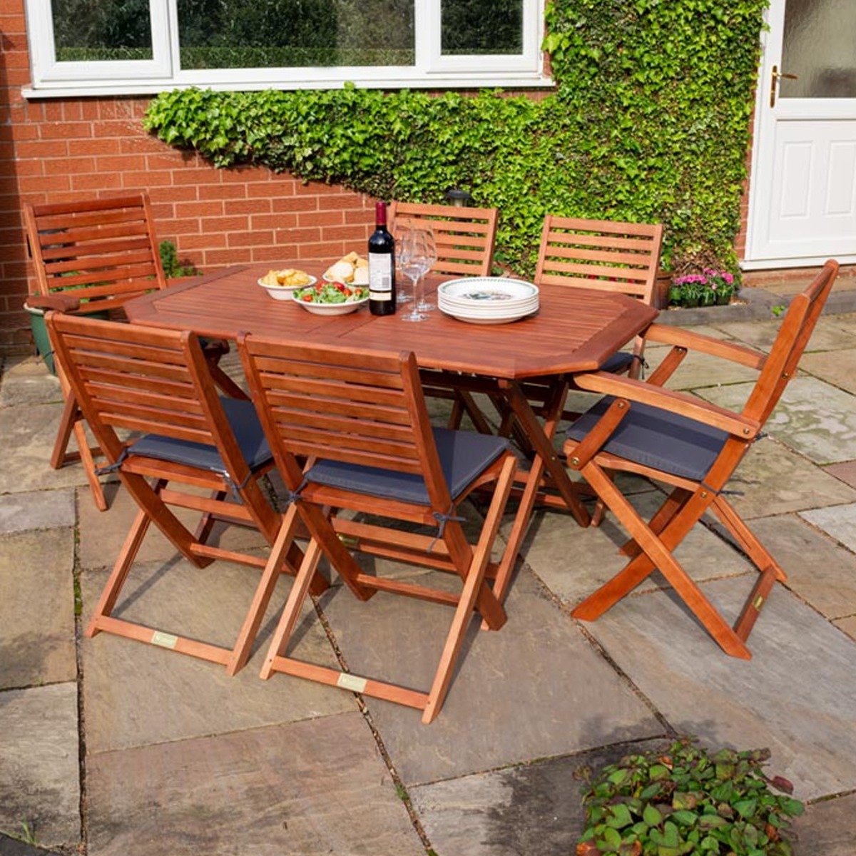 Plumley Outdoor Stained Finish Foldable Six Seater Dining Set with Grey Cushions - Etta Gardens