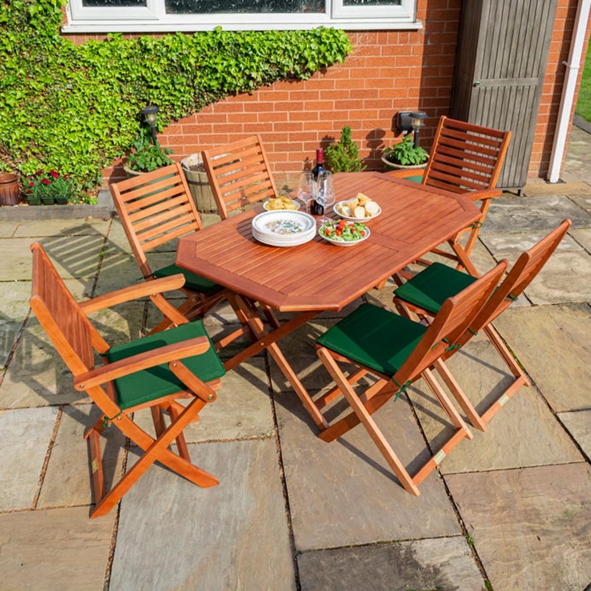 Plumley Outdoor Stained Finish Foldable Six Seater Dining Table Set with Green Cushions - Etta Gardens